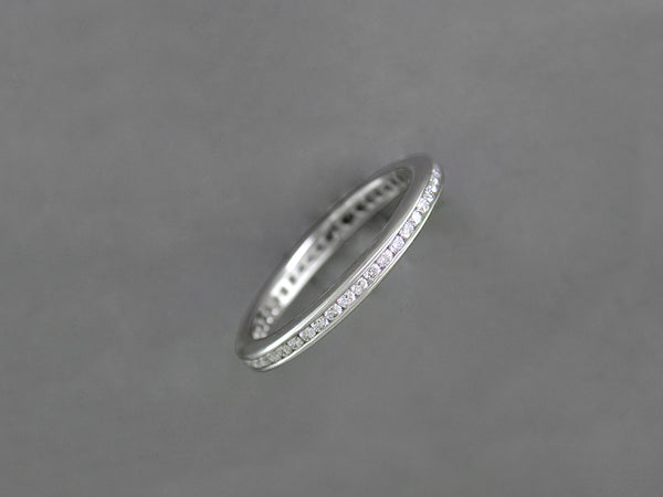 WHITE GOLD, WHITE DIAMOND CHANNEL SET ETERNITY RING